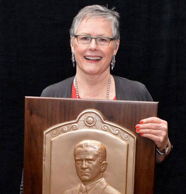 Carolyn P. McDonald holding Hays Award